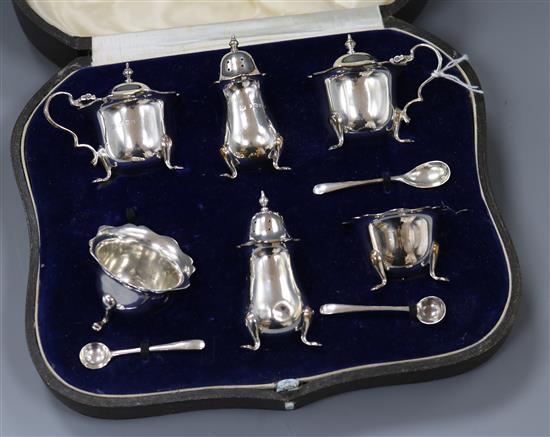 A cased silver six piece condiment set.